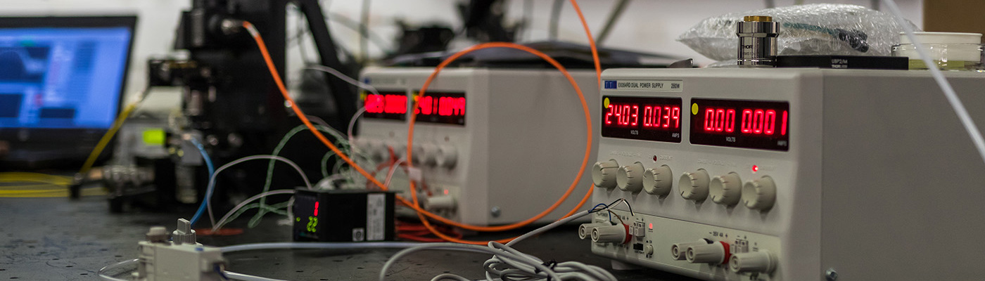 White boxes with red digital displays on counter top